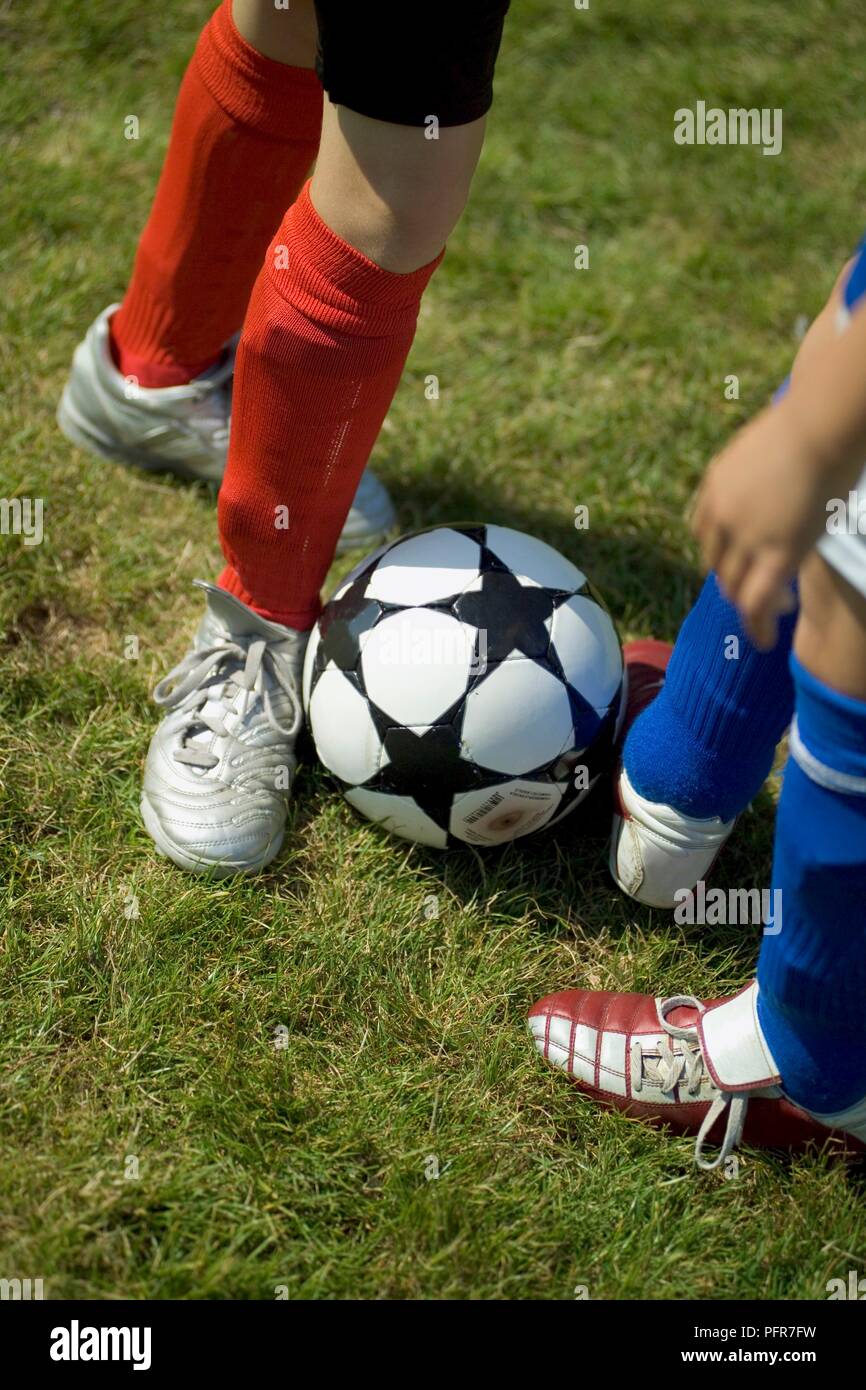 https://c8.alamy.com/comp/PFR7FW/close-up-on-feet-of-children-practising-a-block-tackle-PFR7FW.jpg