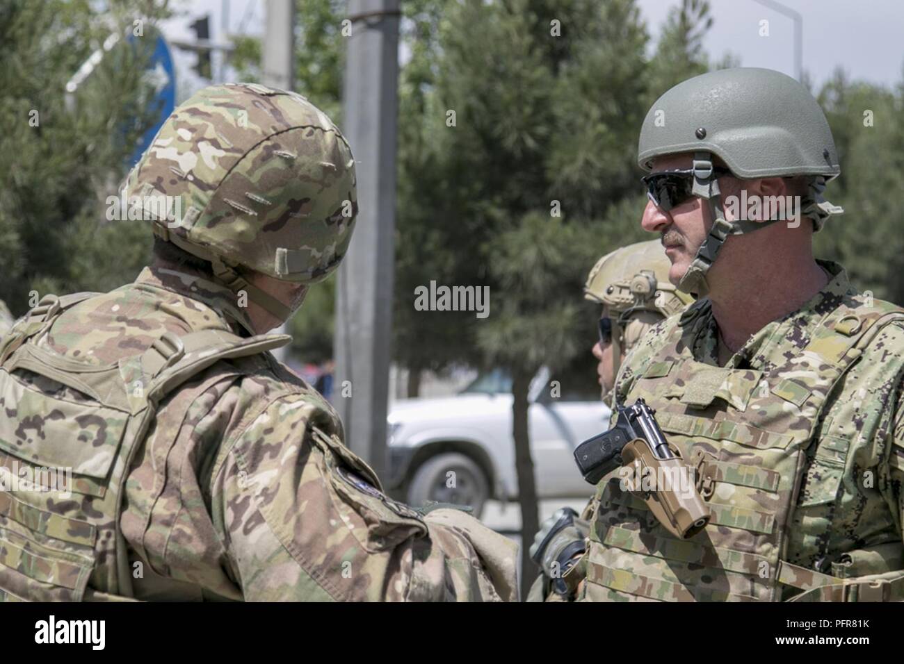 KABUL, Afghanistan (May 21, 2018) -- U.S. Navy Rear Adm. Dell Bull, director of operations and intelligence for the Joint Improvised-Threat Defeat Organization (JIDO), visits various checkpoints throughout Kabul, Afghanistan’s Enhanced Security Zone (ESZ) alongside officials with the Kabul Security Force (KSF), May 21, 2018, to discuss ongoing improvements for the ESZ and ways to successfully continue efforts in strengthening the overall security of the capital from intelligence gathering and sharing with Afghan National Defense and Security Forces (ANDSF) to equipment necessary to reach that  Stock Photo