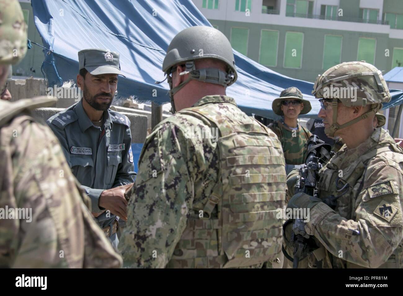 KABUL, Afghanistan (May 21, 2018) -- U.S. Navy Rear Adm. Dell Bull, director of operations and intelligence for the Joint Improvised-Threat Defeat Organization (JIDO), visits various checkpoints throughout Kabul, Afghanistan’s Enhanced Security Zone (ESZ) alongside officials with the Kabul Security Force (KSF), May 21, 2018, to discuss ongoing improvements for the ESZ and ways to successfully continue efforts in strengthening the overall security of the capital from intelligence gathering and sharing with Afghan National Defense and Security Forces (ANDSF) to equipment necessary to reach that  Stock Photo