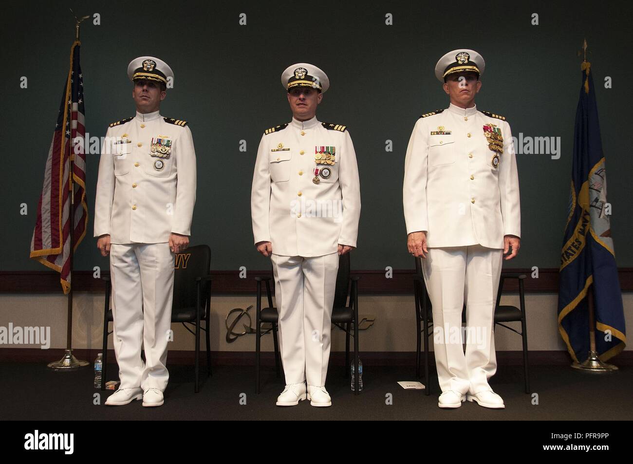 ST. LOUIS (May 23, 2018) – From left, Cmdr. Nathan Rockholm, incoming ...