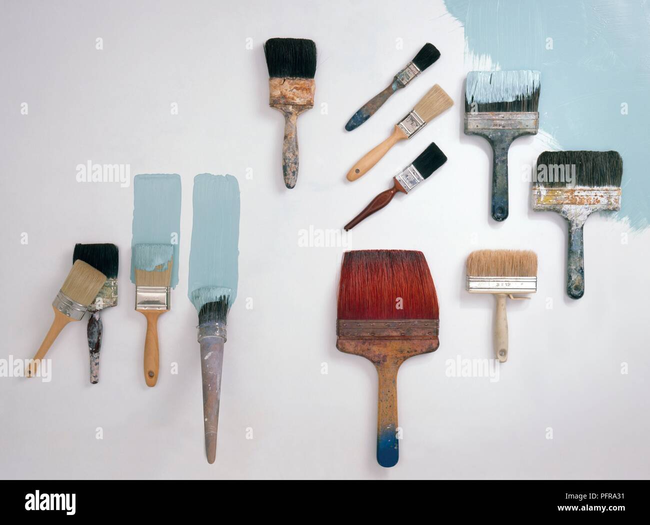 A selection of decorating brushes, including emulsion brushes, flat brushes, sash brushes Stock Photo