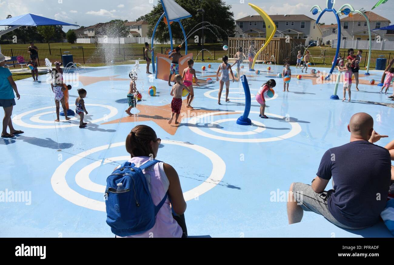 Military children play on the splash pad during the Splash Pad Ribbon
