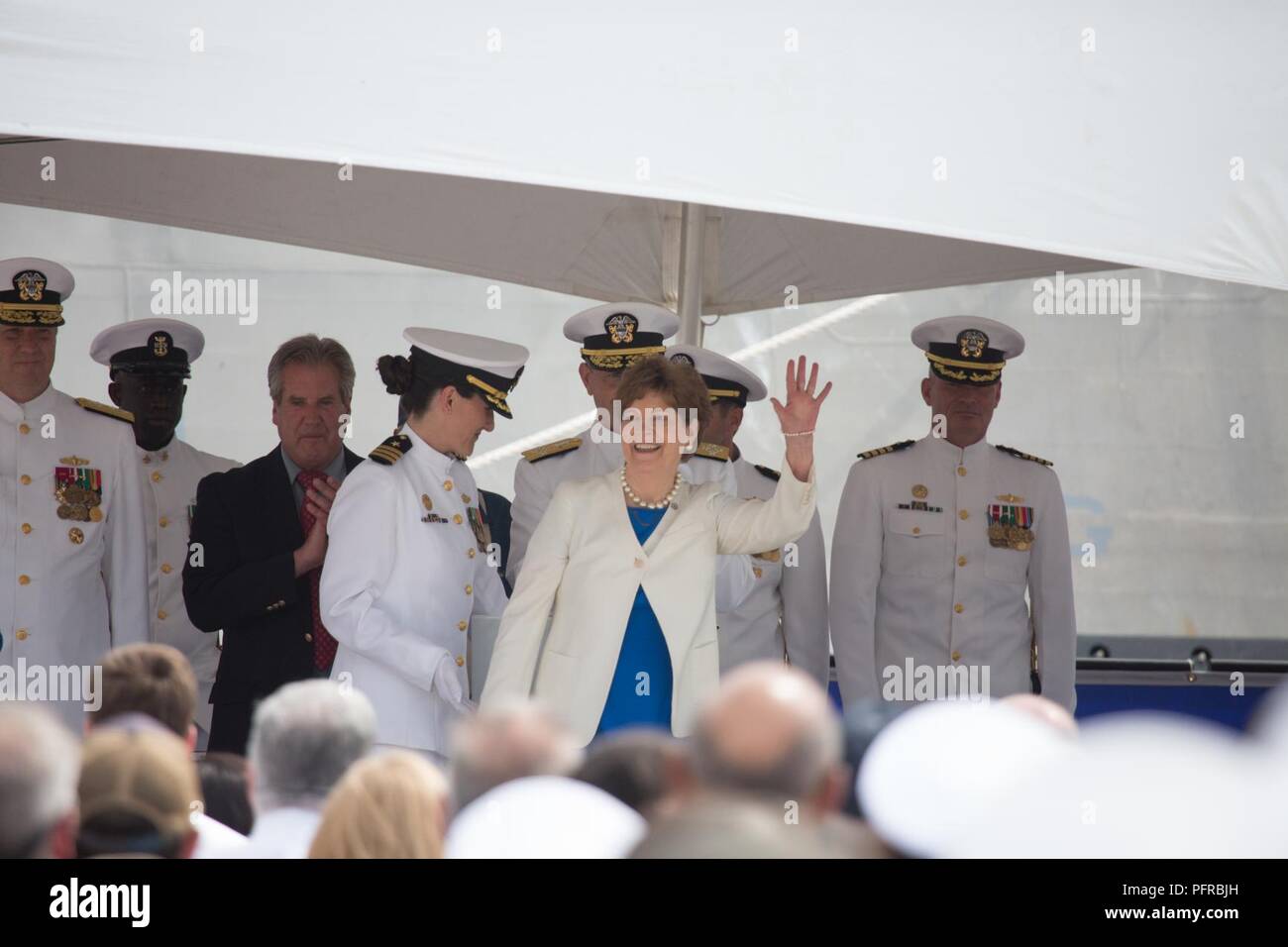 NH (May 26, 2018)  The ship sponsor of the Independence-variant littoral combat ship USS Manchester (LCS 14), Sen. Jeanne Shaheen (D-NH), waves to guests during the ship's commissioning ceremony. Manchester is the 12th littoral combat ship to enter the fleet and the seventh of the Independence variant. The ship is named for the city of Manchester, New Hampshire and is assigned to Naval Surface Forces, U.S. Pacific Fleet. Stock Photo