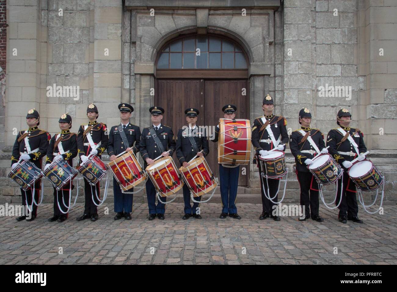 US Army Europe Band drummers stand alongside the drummers of the Royal Logistics Corps at the Citadelle 350 anniversary military show, May 25, 2018, Lille, France.  US Army Stock Photo