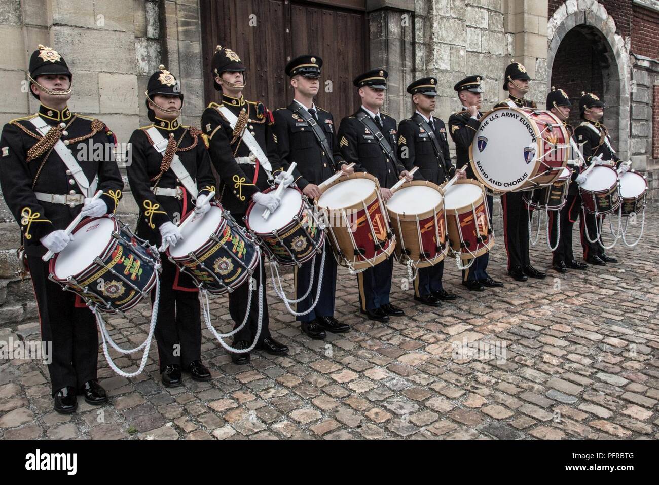 US Army Europe Band drummers stand alongside the drummers of the Royal Logistics Corps at the Citadelle 350 anniversary military show, May 25, 2018, Lille, France.  US Army Stock Photo
