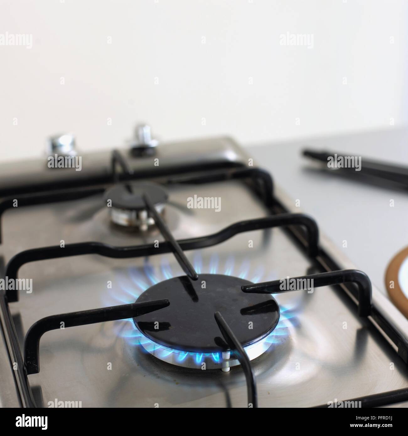 Gas hob with flame alight Stock Photo Alamy