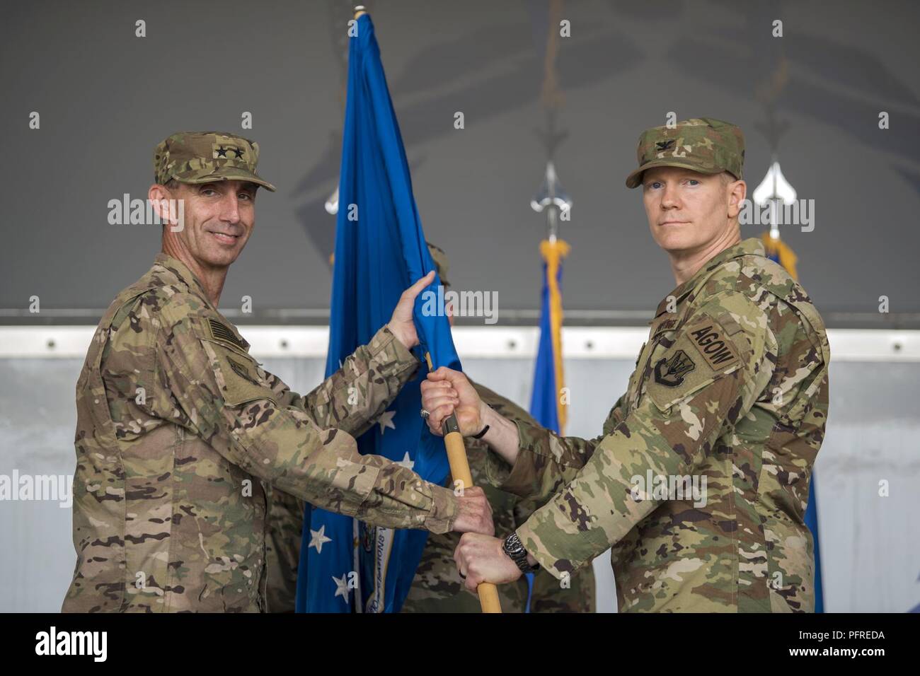 Maj. General Scott Zobrist, left, 9th Air Force Commander, hands the