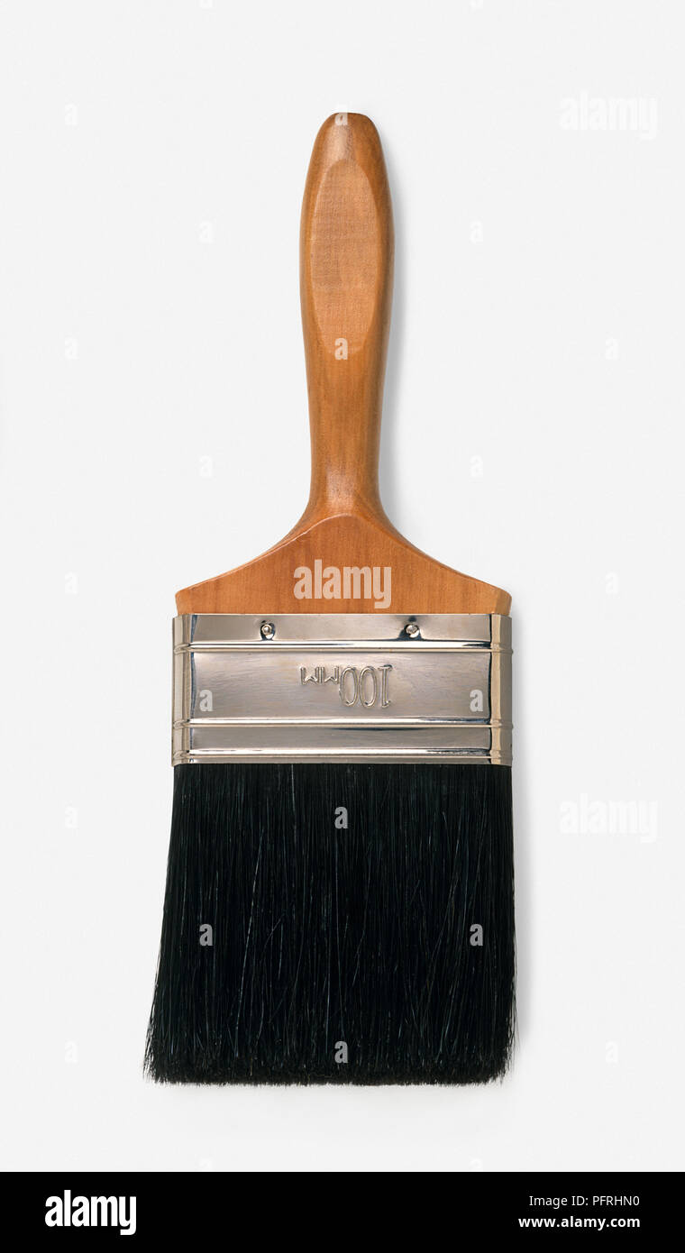 Large decorating paintbrush with wooden handle and black bristles Stock Photo