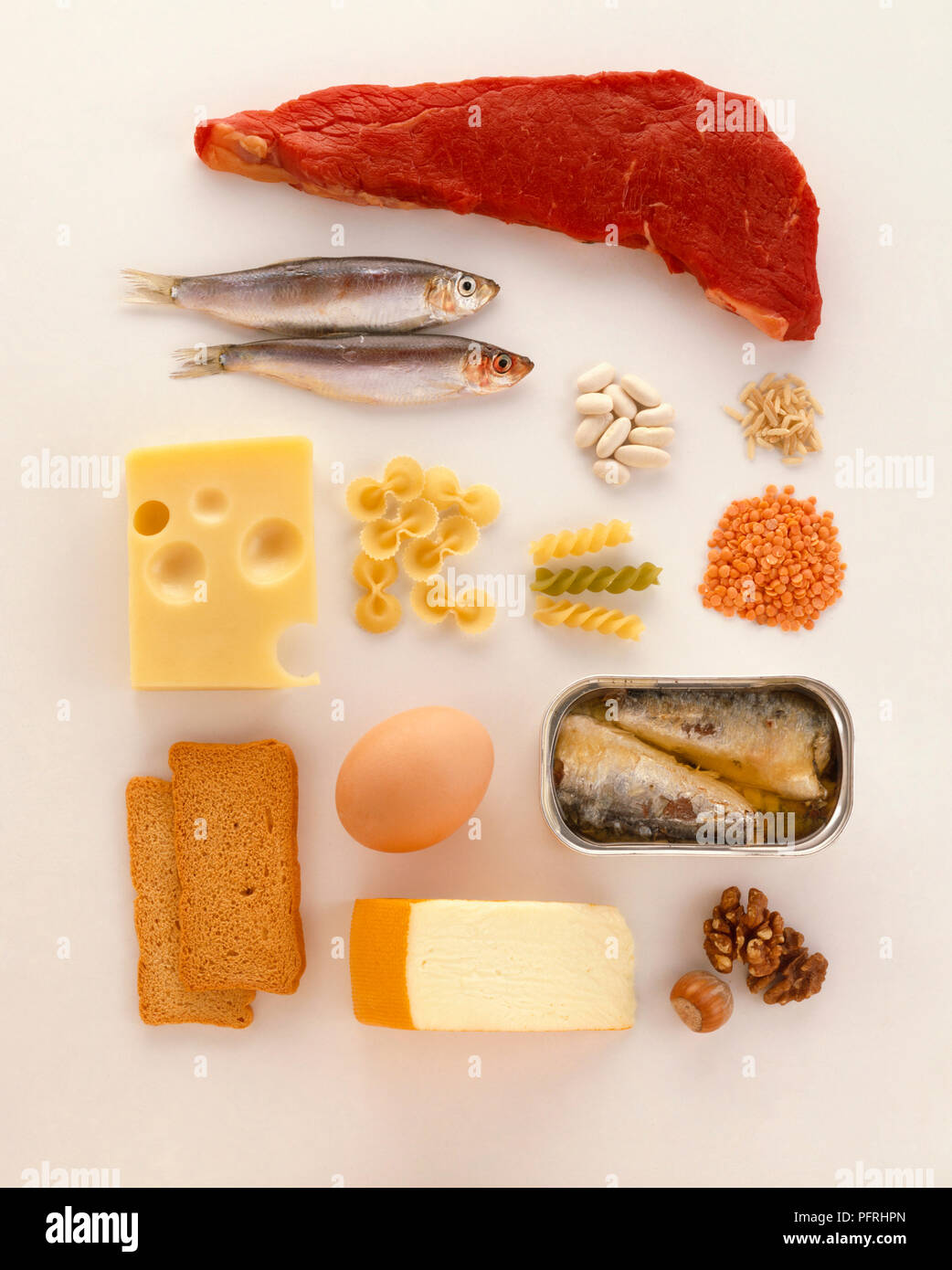 Various types of food, including red meat, fish, beans, pasta, cheese,  eggs, nuts, bread Stock Photo - Alamy