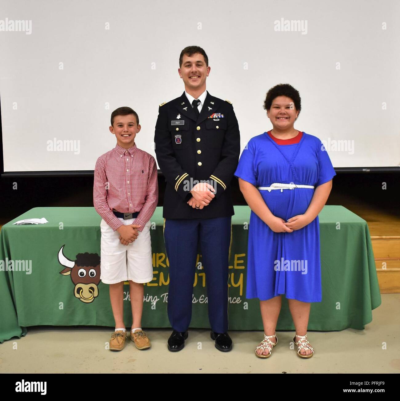 Capt. Thornton Ray, the operations officer (S-3) for the 1st Area Medical Laboratory, 20th Chemical, Biological, Radiological, Nuclear, Explosives (CBRNE) Command, poses for a photo with fifth graders Alicia Pembroke and Jack Geyer after his speech at the annual Churchville Elementary School Fifth Grade Patriot Assembly on Thursday, May 24. Pembroke and Geyer completed the Patriot Program by meeting all the requirements (see attached article). Pembroke recited the Gettysburg Address and Geyer wrote a Patriot report on Jenny Wade, the only civilian killed during the battle of Gettysburg. Stock Photo