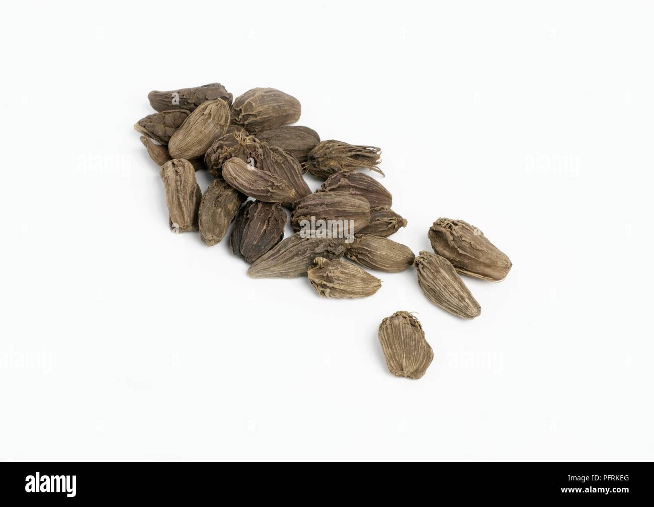 Heap of black cardamom seed pods Stock Photo