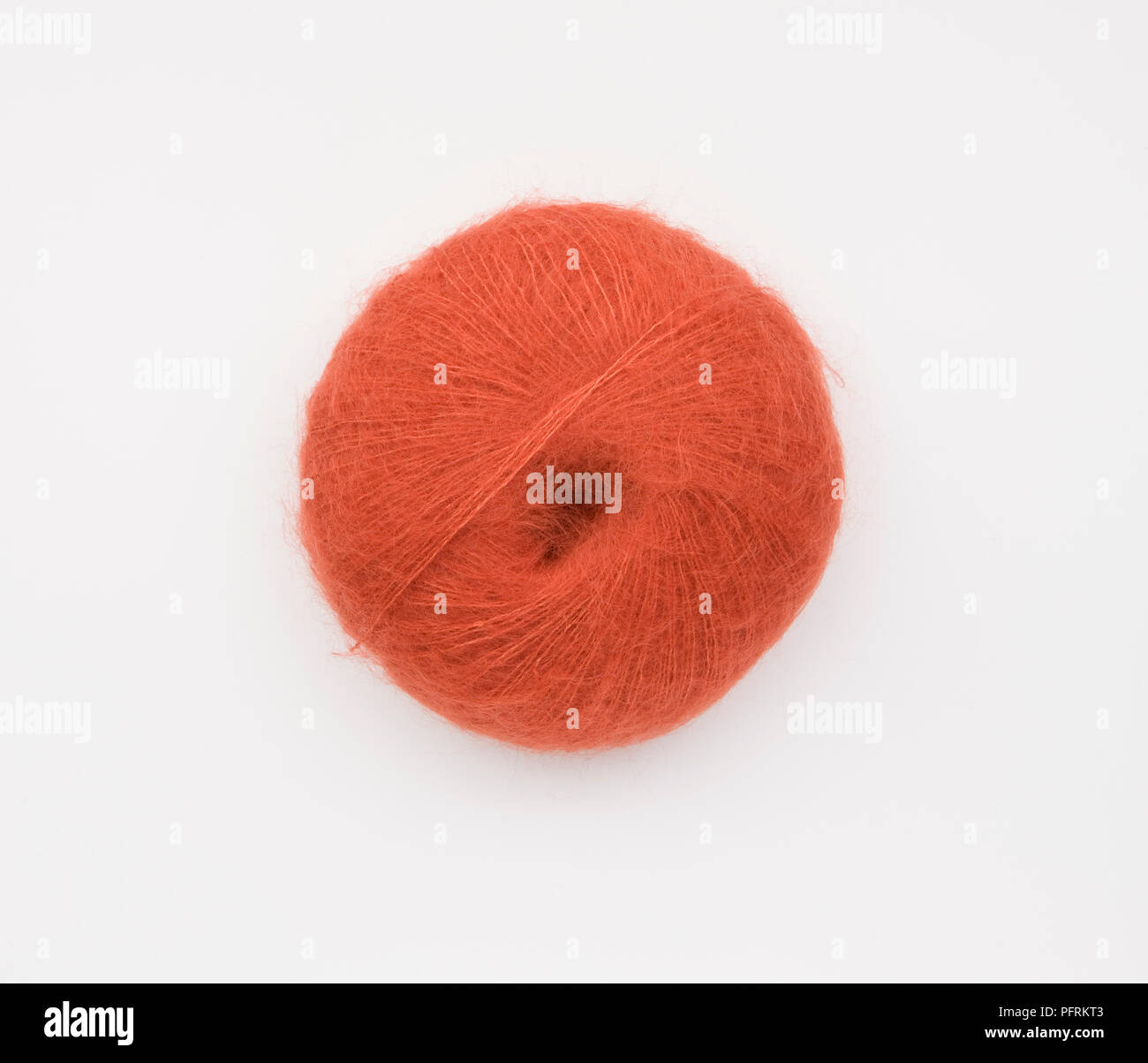 Ball of fine red mohair yarn Stock Photo