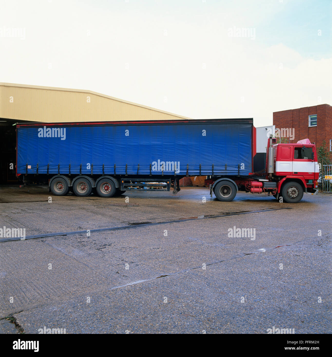 Large blue and red freight vehicle Stock Photo - Alamy