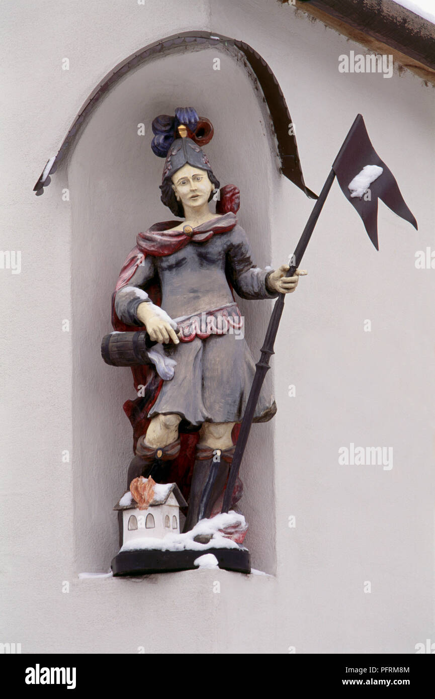 Austria, Vienna, Mayer am Pfarrplatz, wooden niche statue of St Florian on facade of house (1820) Stock Photo