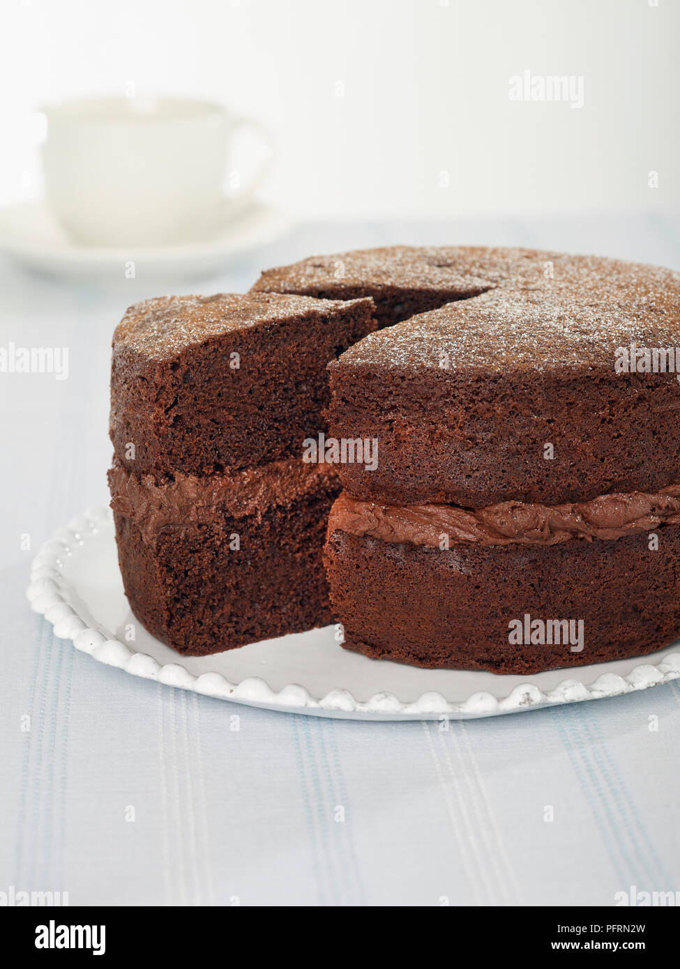 Chocolate cake with buttercream filling Stock Photo Alamy