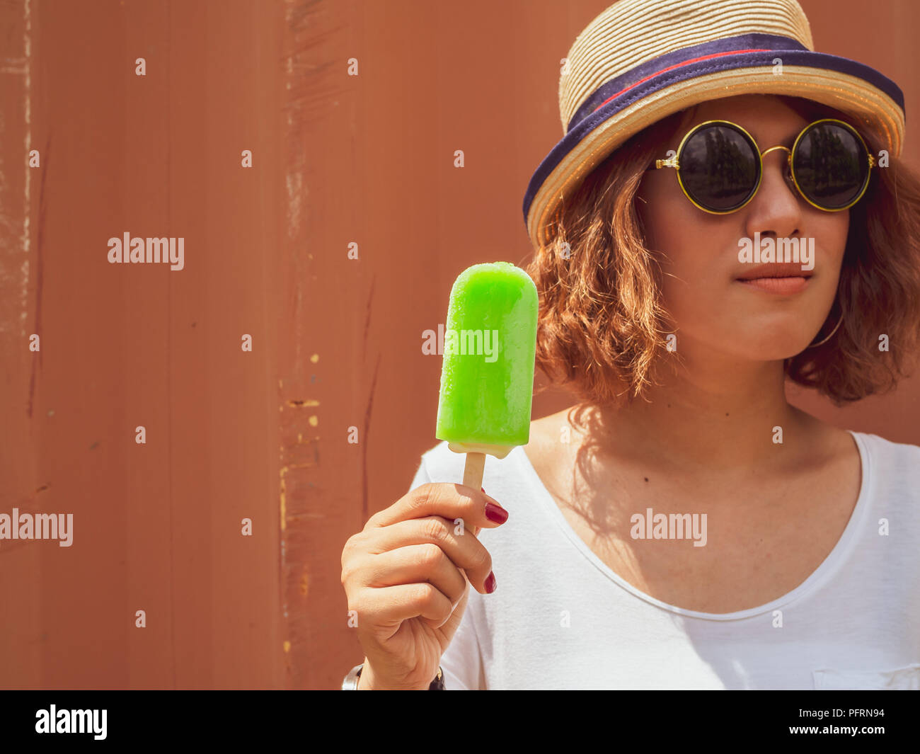 Beautiful Woman Short Hair Wearing White Shirt Hat And Round