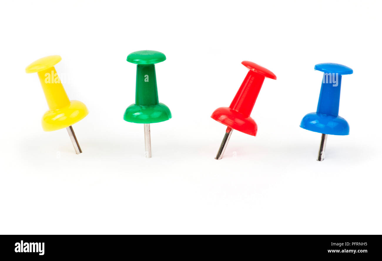 Four colourful push pins Stock Photo Alamy
