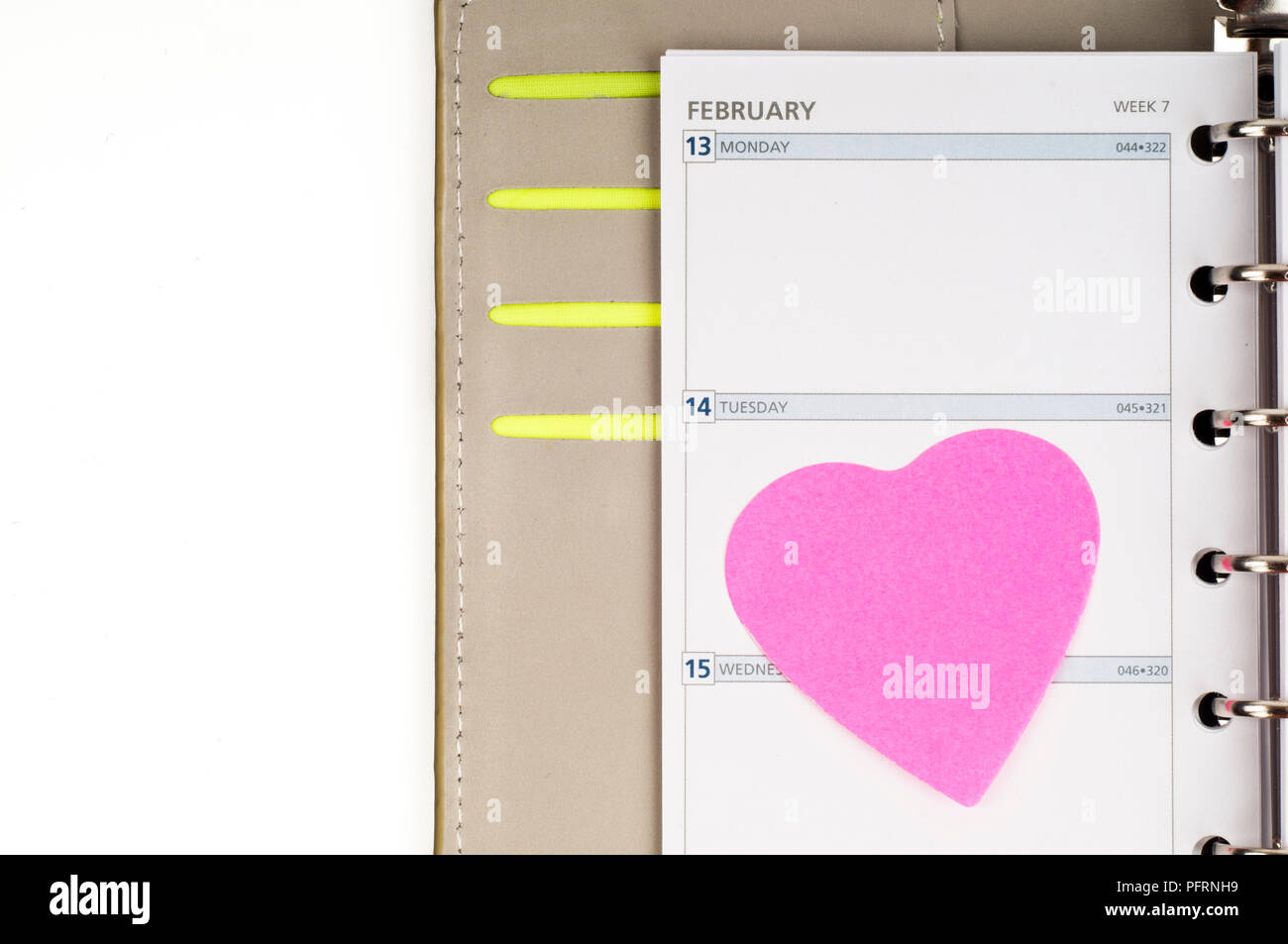 Pink heart on diary page, February 14, Valentine's Day Stock Photo