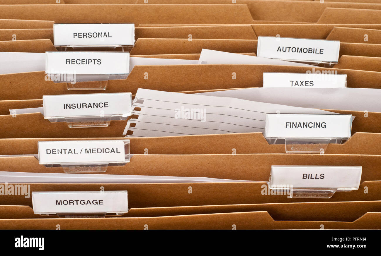 Files in filing box with various labels, including finance, bills ...