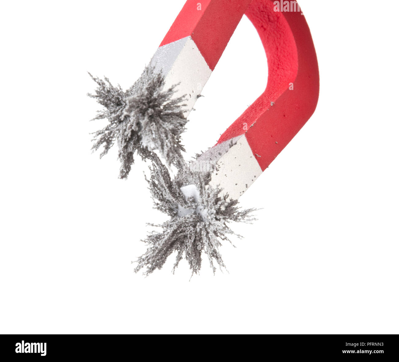 Horseshoe attracting metal filings Stock Photo Alamy