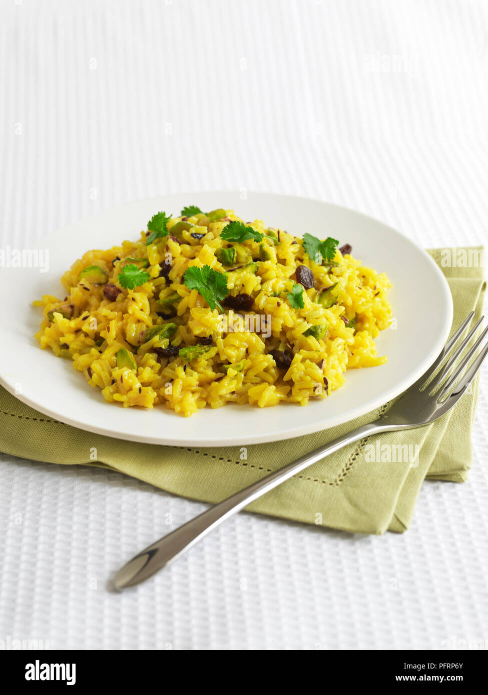 Persian pilaf saffron rice with raisins and coriander Stock Photo Alamy