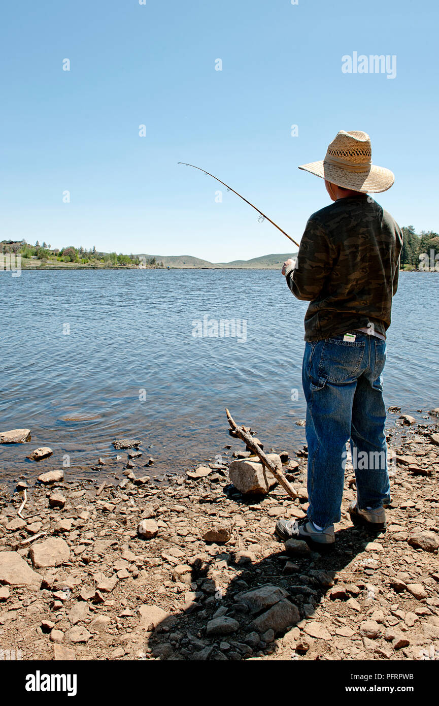 USA, California, San Diego County, Cuyamaca Rancho State Park, man fishing at water's edge Stock Photo