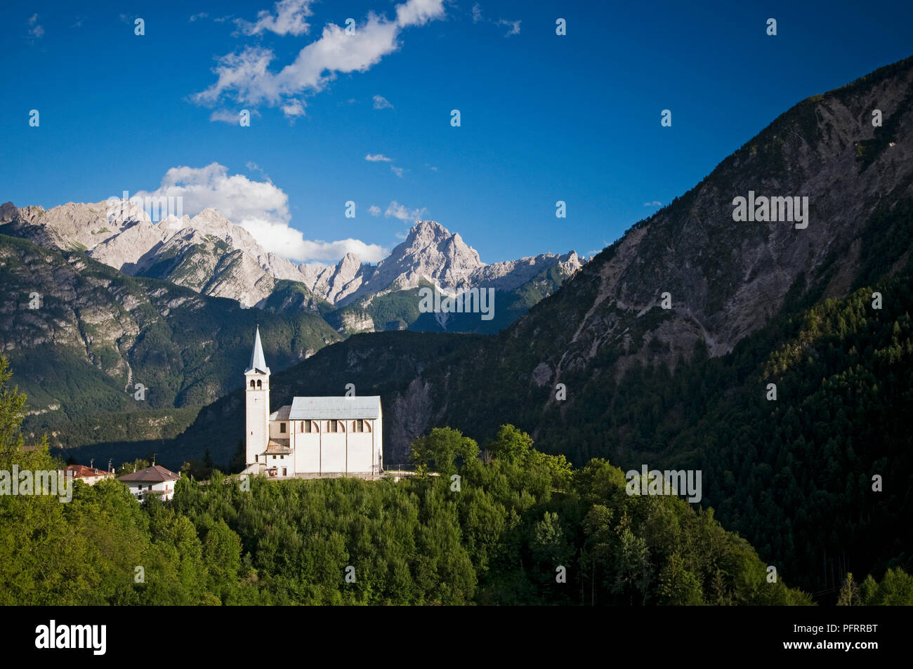 Italy, Veneto, Belluno Province, church in Valle Di Cadore, surrounded by Dolomites mountains Stock Photo