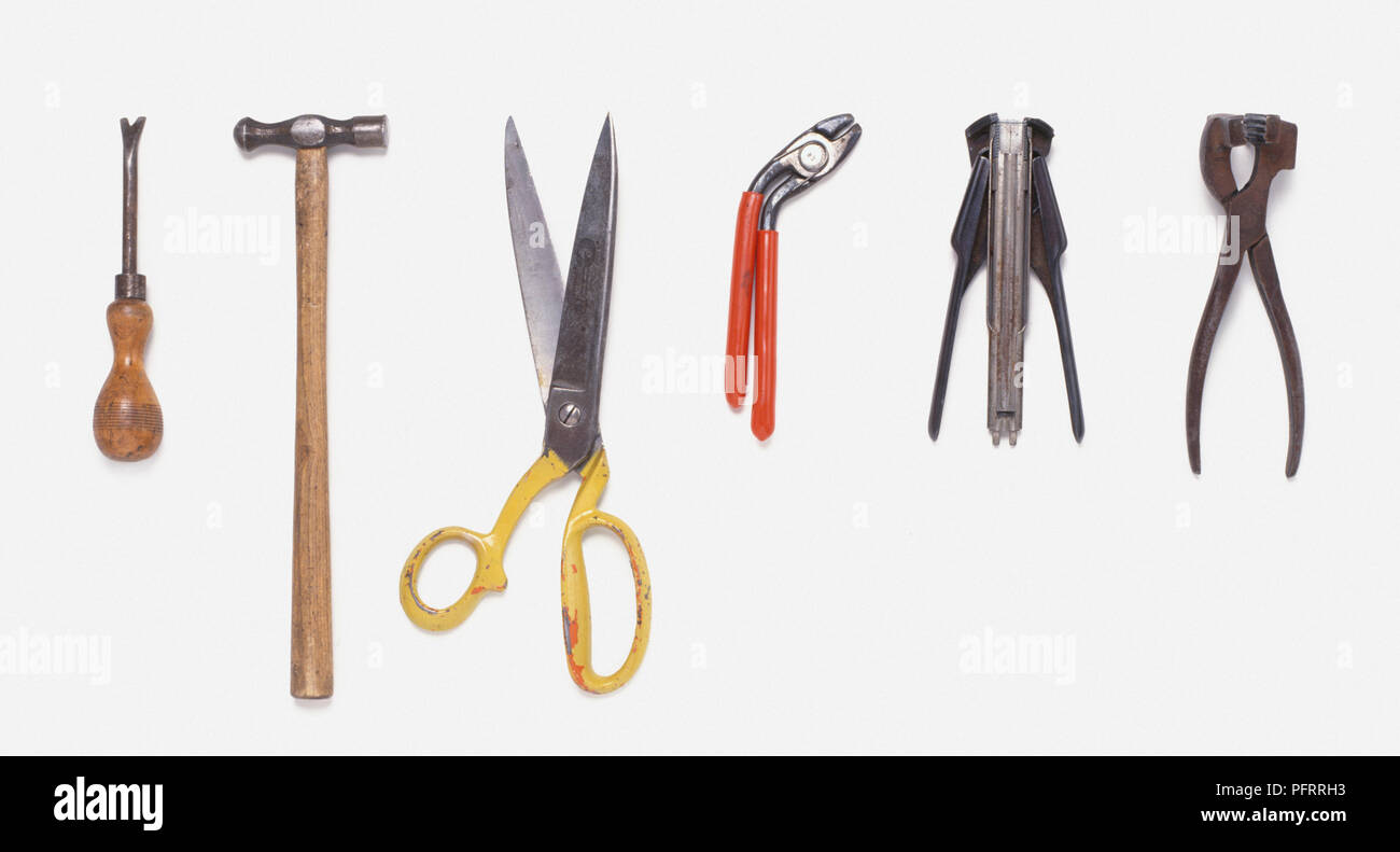 Set of pliers, hammer, and large scisoors Stock Photo