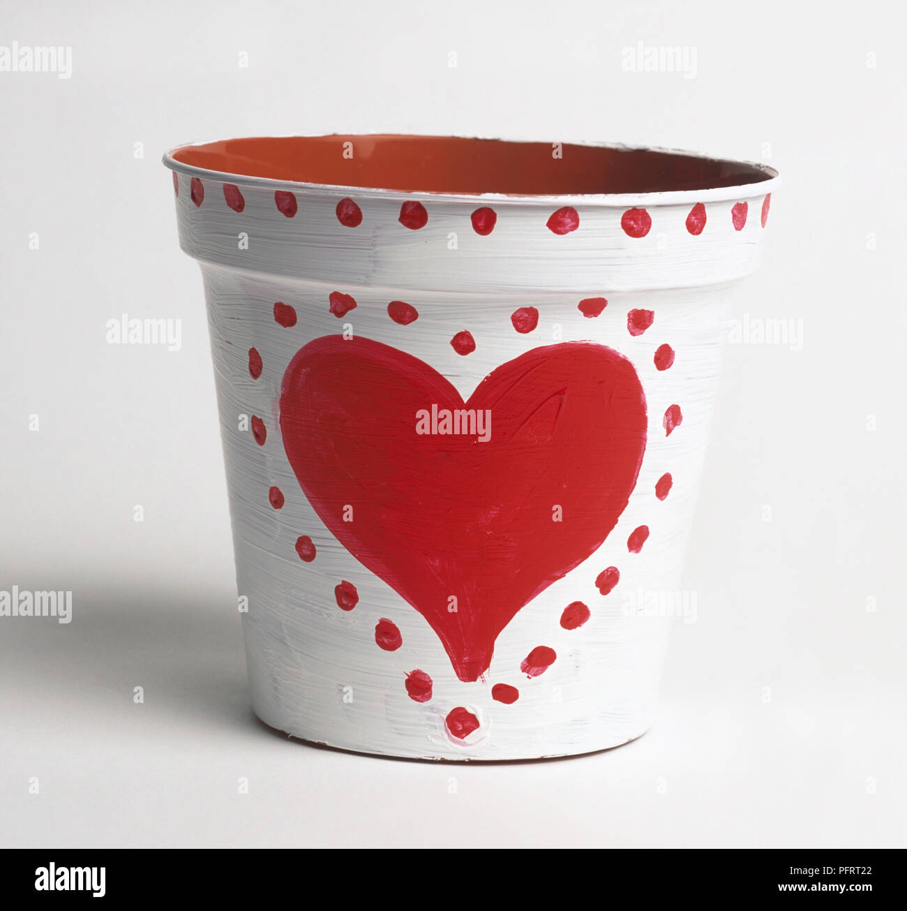 Empty plant pot painted with love heart and dots Stock Photo
