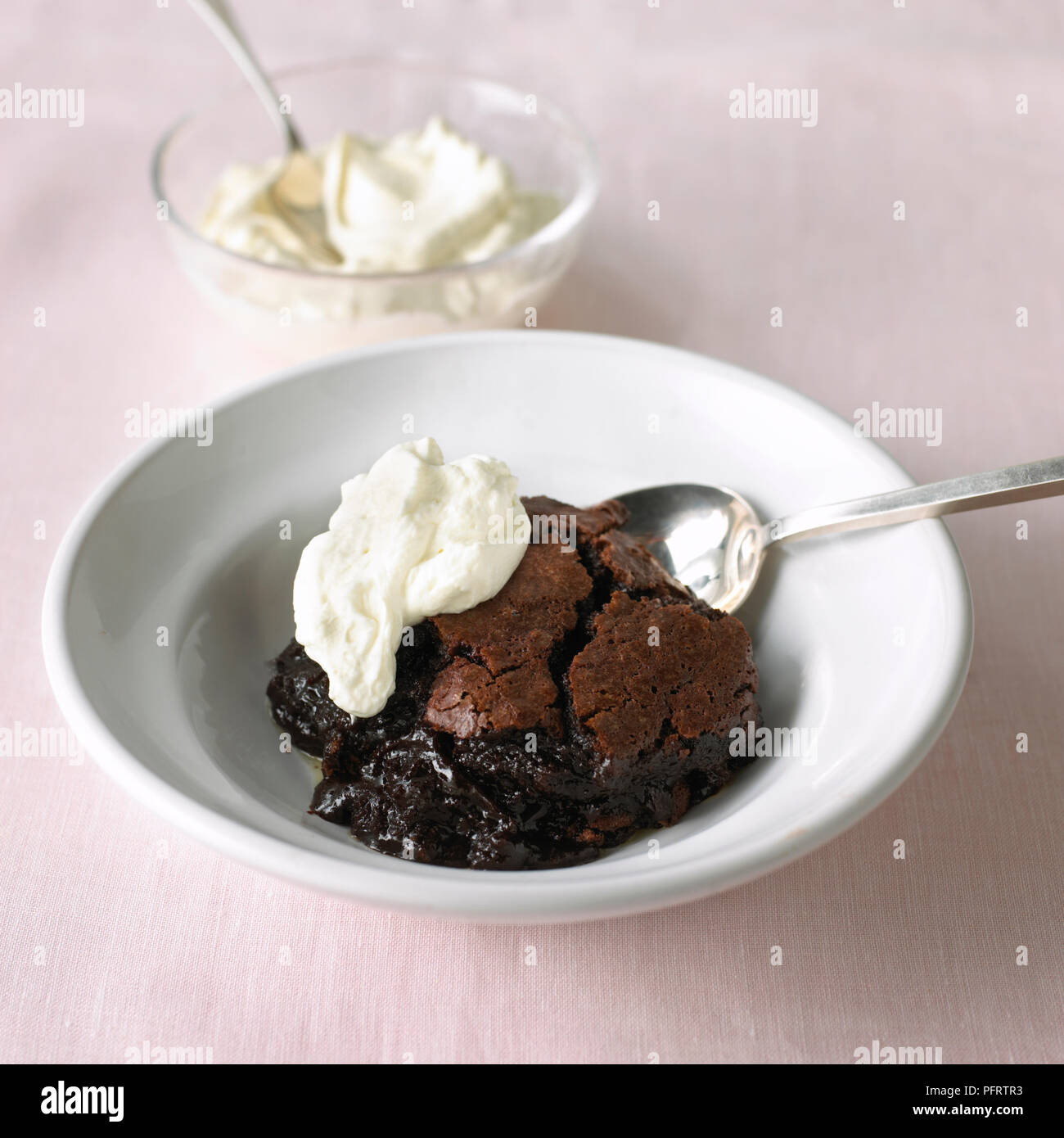 Chocolate brownie pudding with cream Stock Photo