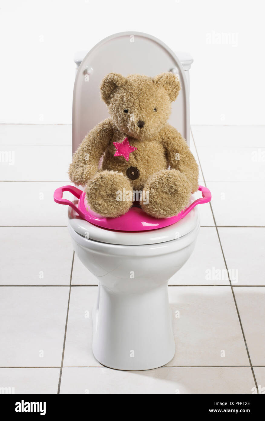 Toilet with training seat for toddler Stock Photo