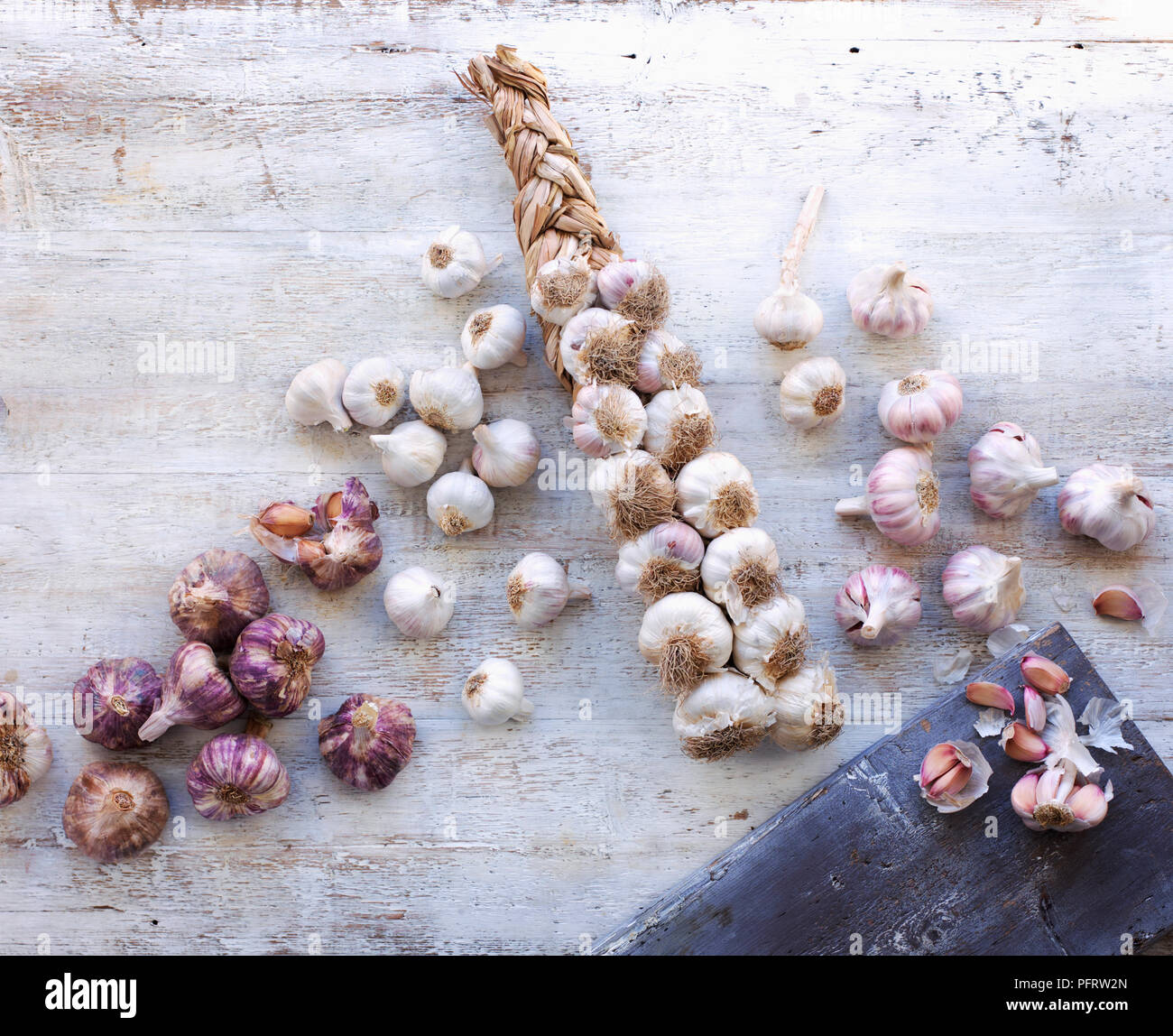 Different types of garlic, Aglio Rosso di Nubia from Sicily, white garlic, plaited garlic, Ail Rose de Lautrec (pink garlic) from France Stock Photo