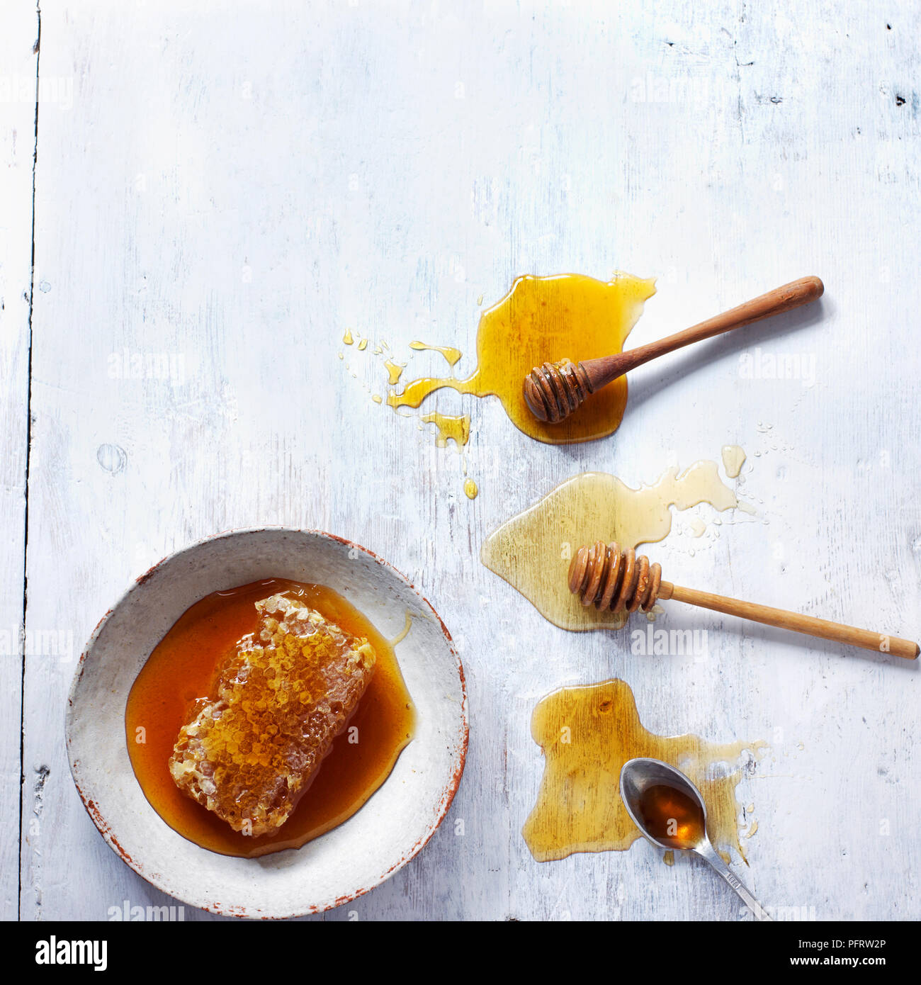 Different types of honey, lavender honey, orange blossom honey, rosemary honey, and beeswax combs Stock Photo