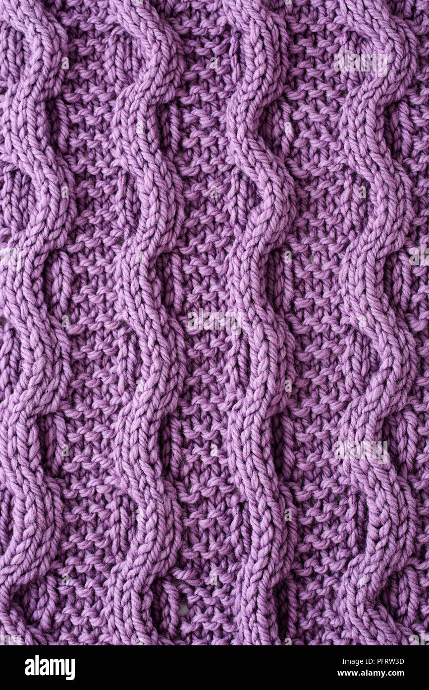 Chunky cable knitted lap blanket Stock Photo