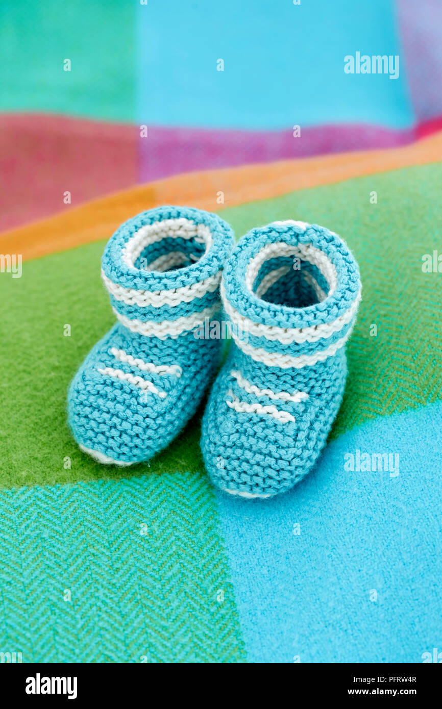 Knitted baby booties Stock Photo
