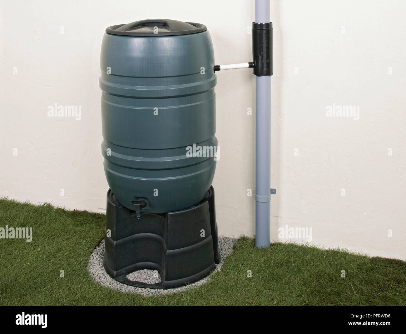 Collecting rainwater, water butt and rain diverter Stock Photo - Alamy