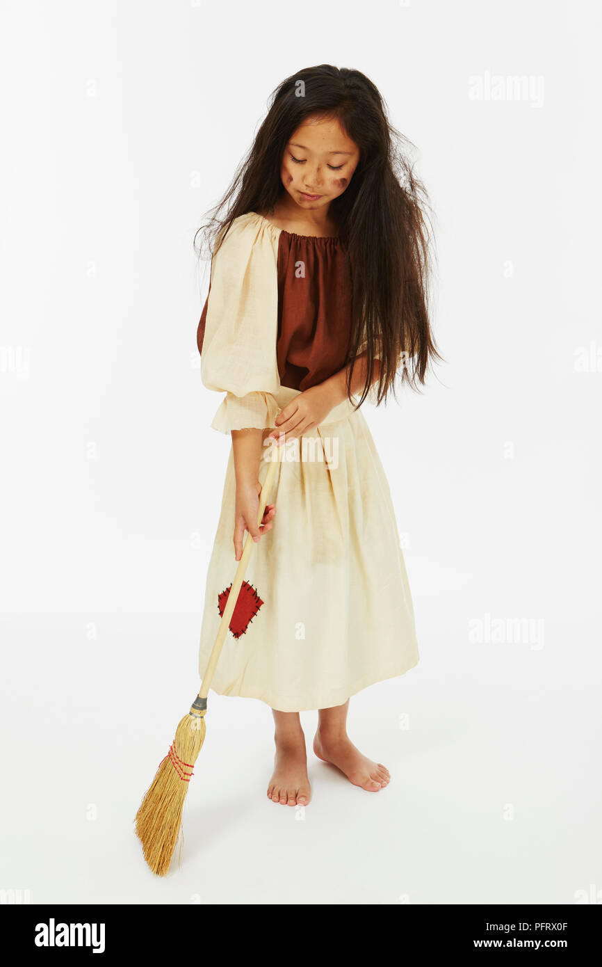 Young girl dressed as Cinderella in rags costume Stock Photo