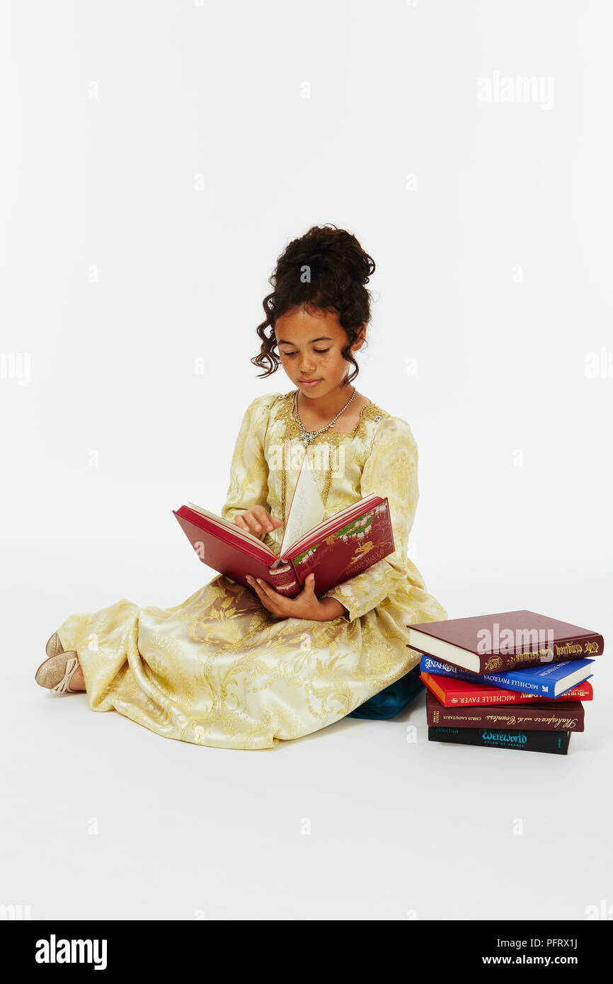 Girl dressed in gold princess style costume Stock Photo