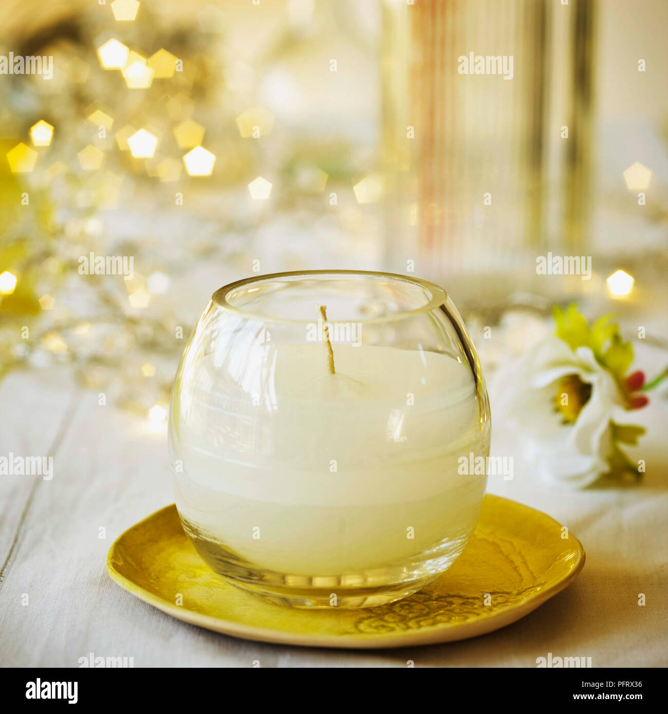 Wedding dinner table reception. Wedding table decoration - white branch  from a tree, crystal pendants, candles in glass spheres, on a white table  with Stock Photo - Alamy