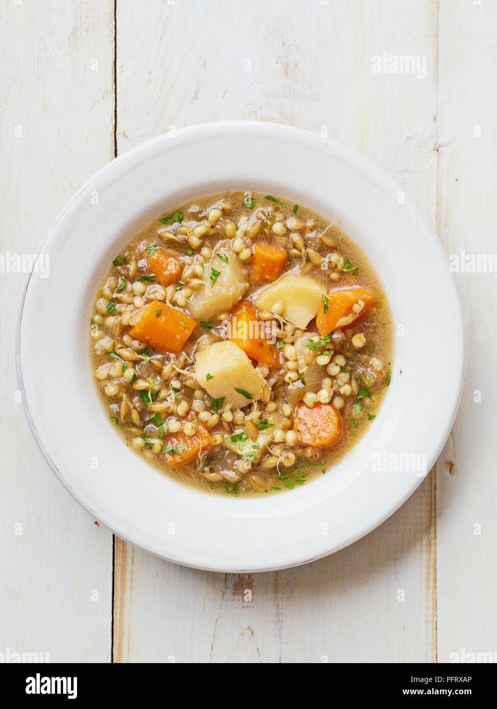 Root vegetable and sorghum stew Stock Photo