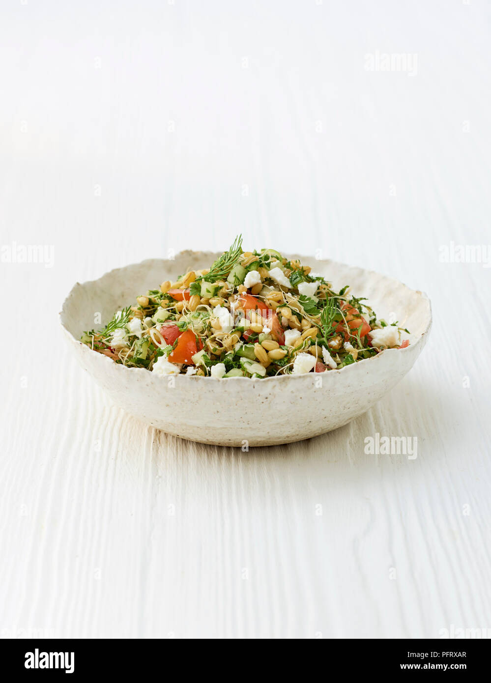 Sprouted tabouleh with feta and mint Stock Photo