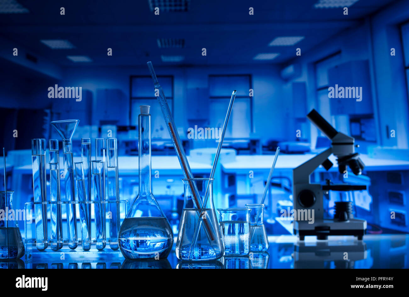 Science laboratory. Experiment with liquids. Laboratory glassware Stock