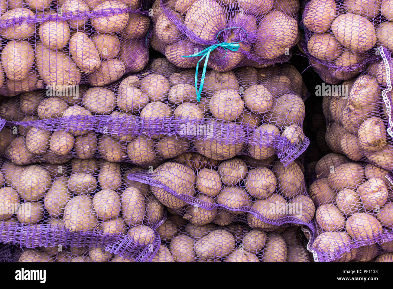 The background of potatoes in mesh bags Stock Photo Alamy