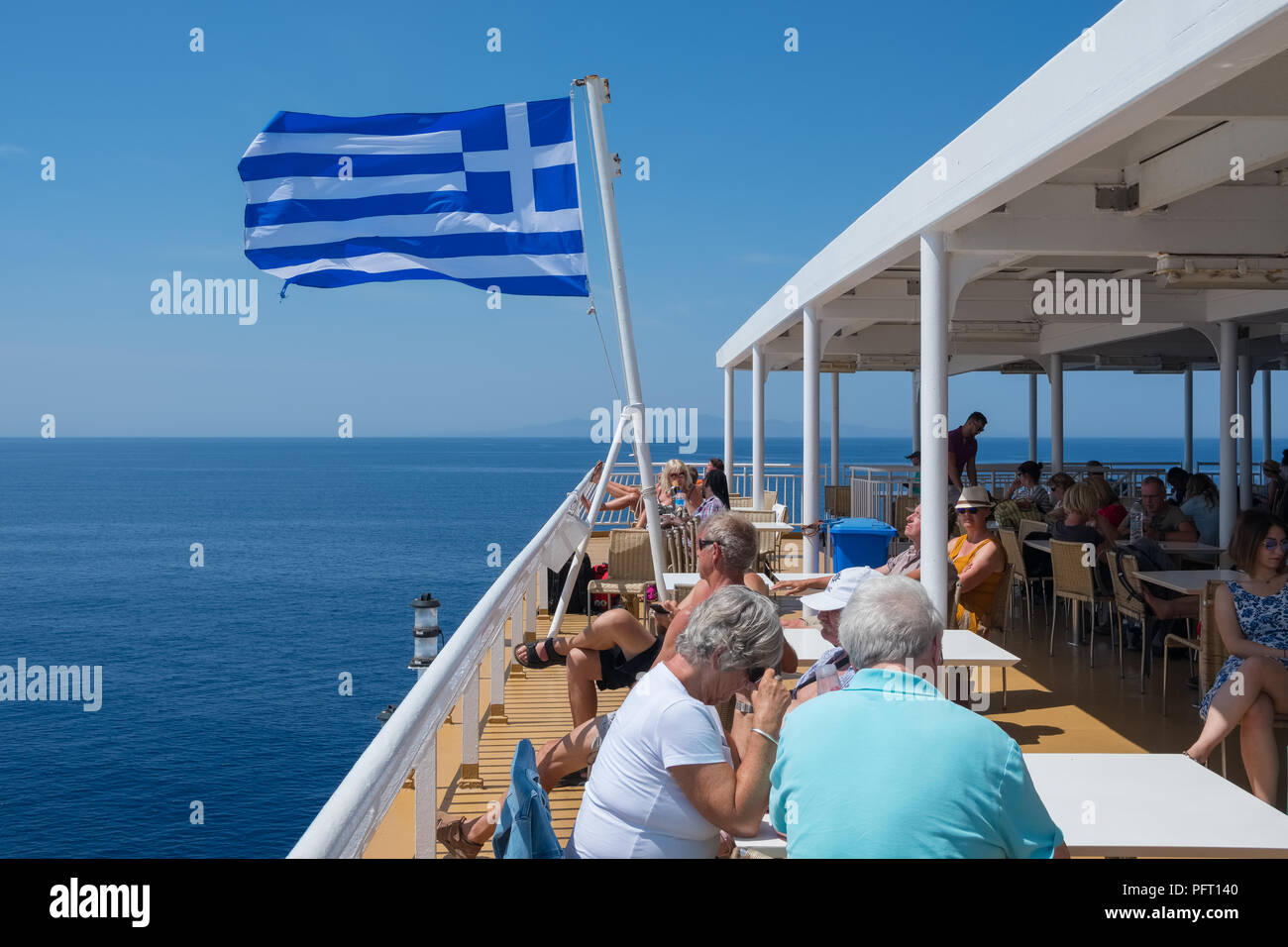 Paros, Greece - June 5, 2018: Tourists traveling on a Greek ferry boat through the cyclades of Greece Stock Photo
