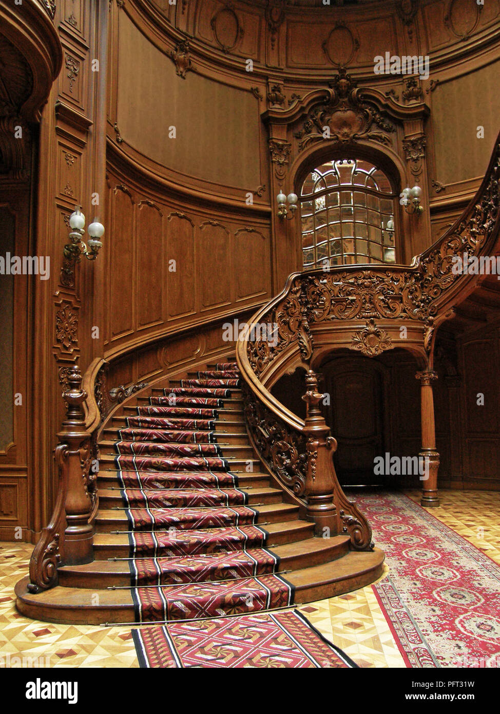 LVIV, UKRAINE - MAY 1: A carved wooden staircase in ancient casino on May 1, 2010 in Lviv, Ukraine Stock Photo