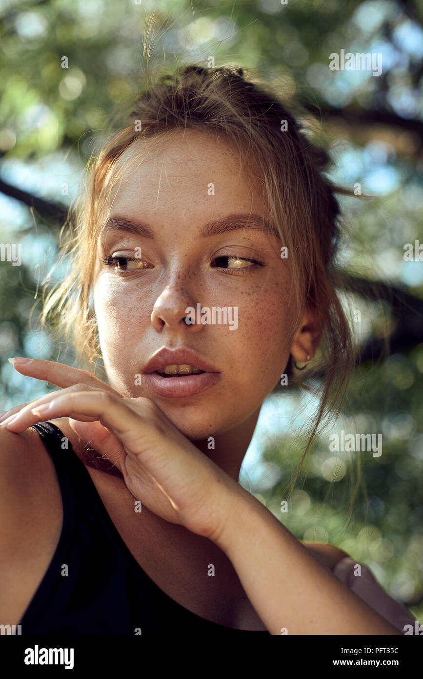 portrait of cute beautiful young girl with freckles close-up. Stock Photo