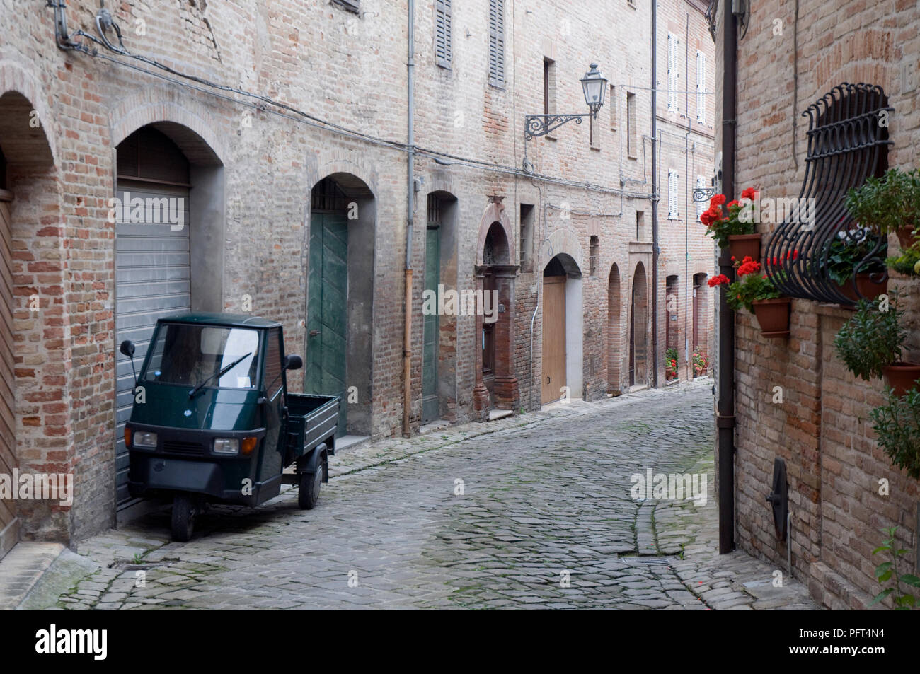 Italy, Le Marche, Amandola, back street with three wheel mini truck Stock Photo