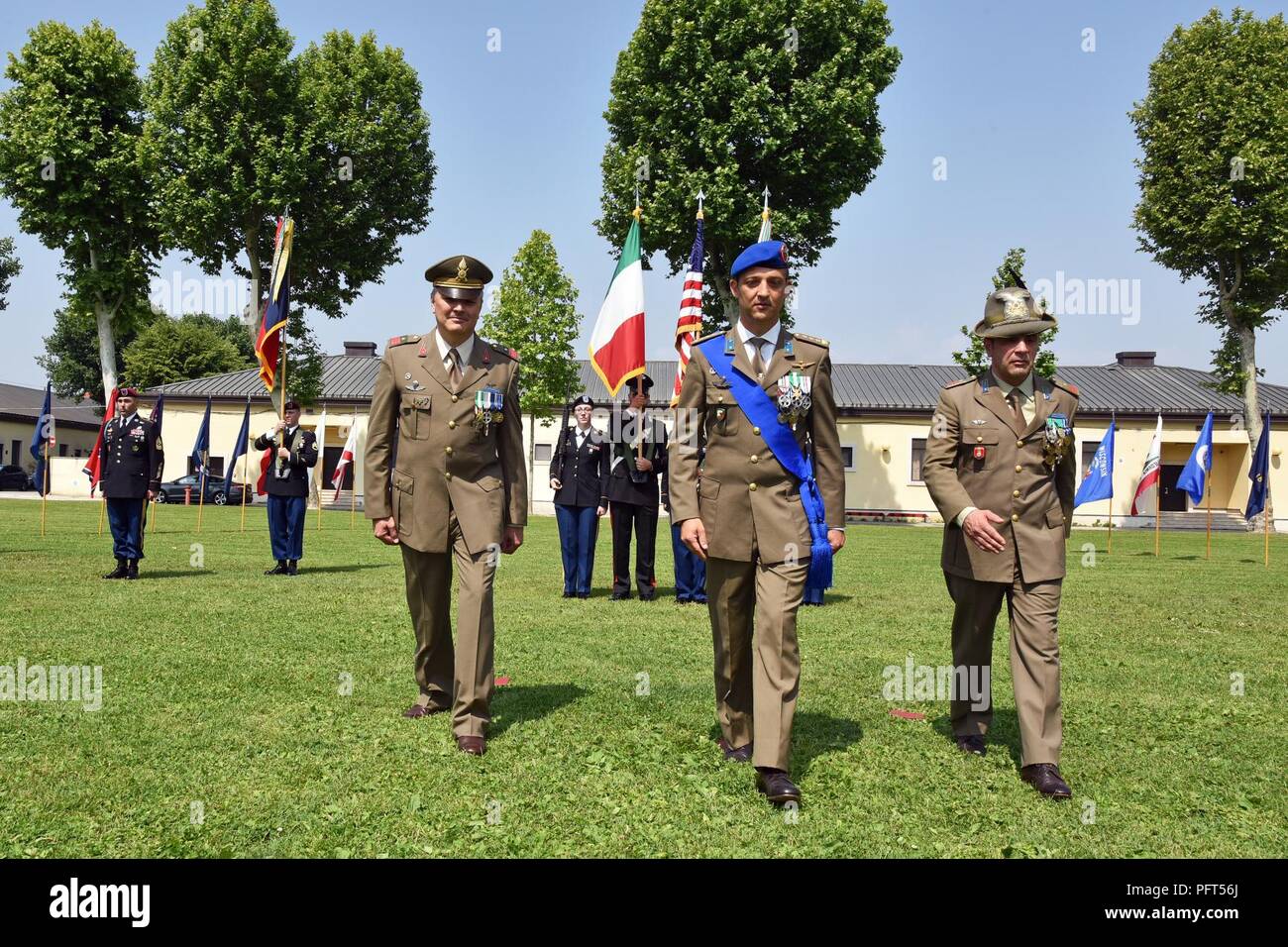 (From Left) Italian Army incoming Command Sgt. Maj. Ennio Zavagno of the Italian Base, Col. Umberto D’Andria, Italian Base Commander and outgoing Command Sgt. Maj. Antonio Quaglia march back to their seats during the Italian Base Command Change of Responsibility at Caserma Ederle in Vicenza, Italy, May 31, 2018. Stock Photo