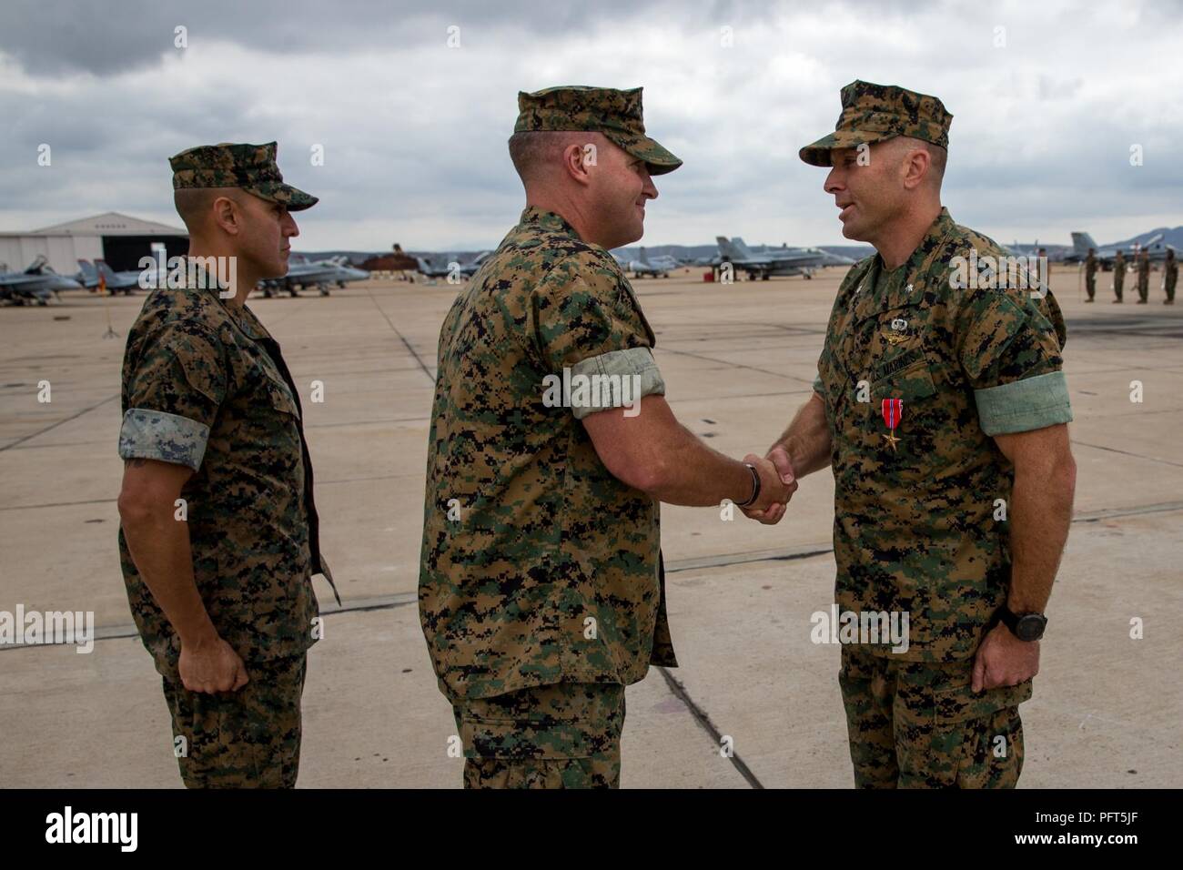 Lt. Col. Dustin J. Byrum, the outgoing Marine Fighter Attack Squadron (VMFA) 314 commanding officer, receives a Meritorious Service Medal for commendatory service while serving with the "Black Knights" in a ceremony at Marine Corps Air Station Miramar, Calif., May 31. VMFA-314 was commissioned on October 1, 1943 at MCAS Cherry Point, N.C., and moved to MCAS Miramar in February of 1996. Stock Photo