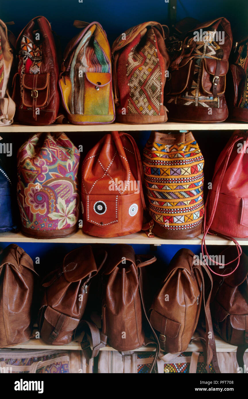 Morocco, Fes, embroidered leather bags on shelves Stock Photo